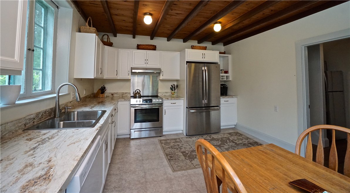 216 Highland Drive Jamestown, RI 02835 - Photo 21 of 39 Sun-filled Eat in Kitchen is 17' x 13'. Recently updated with new appliances and more!