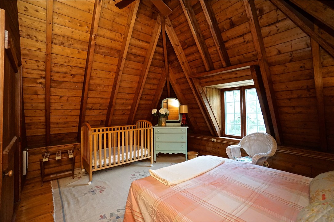 216 Highland Drive Jamestown, RI 02835 - Photo 27 of 39 One of 5 Bedrooms on the second level. Two Bedrooms and a full Bath are on the right wing, three Bedrooms and an additional full Bath are in the left wing.