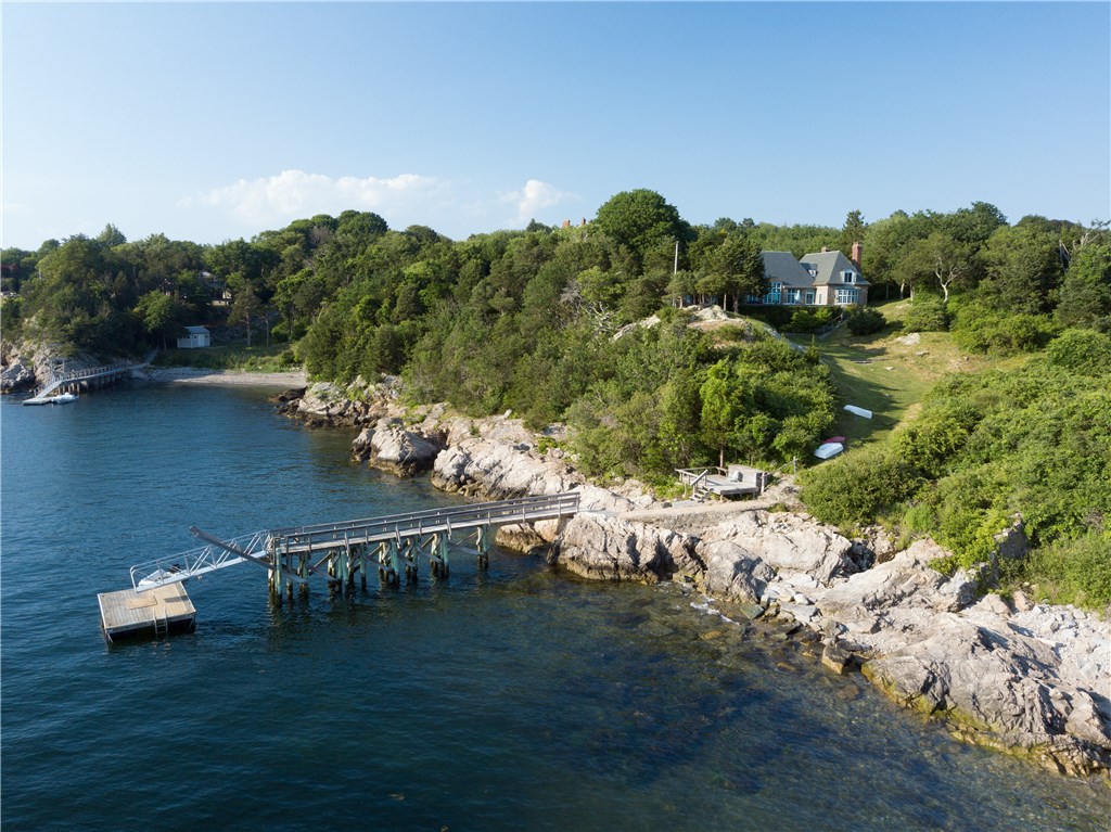 216 Highland Drive Jamestown, RI 02835 - Photo 4 of 39 This private compound comprises two properties, and has a rare protected deep water dock!