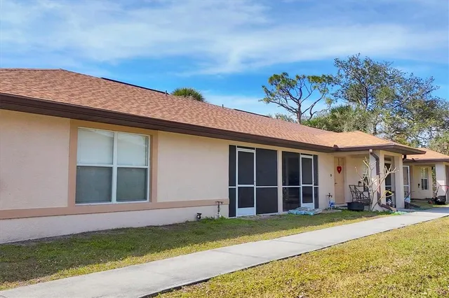 a view of a backyard with a garden and plants