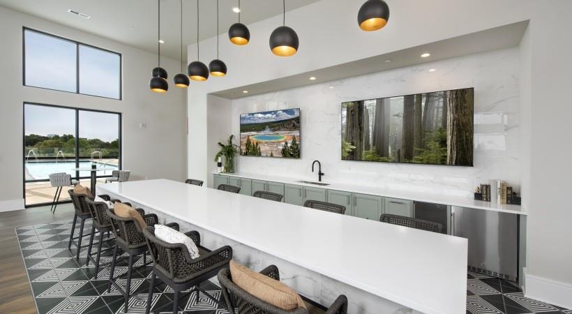 2180 Shadowood Parkway, Unit 434 Atlanta, GA 30339 - Photo 18 of 28 a large kitchen with a table and chairs