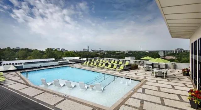 a view of a swimming pool with chairs