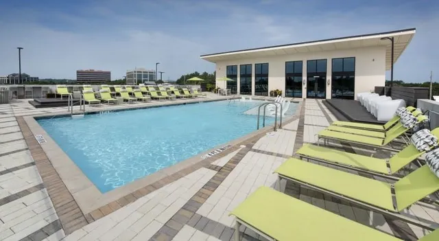 a view of swimming pool with outdoor seating