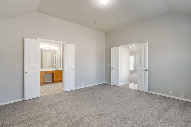 an empty room with a bathroom