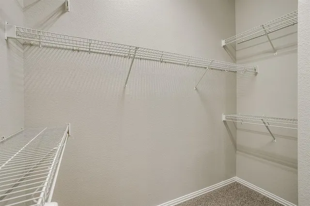 a view of a room with racks on the wall