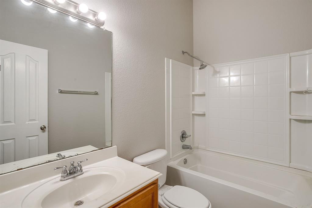 928 Remington Ranch Road Mansfield, TX 76063 - Photo 17 of 20 a bathroom with a sink toilet and shower