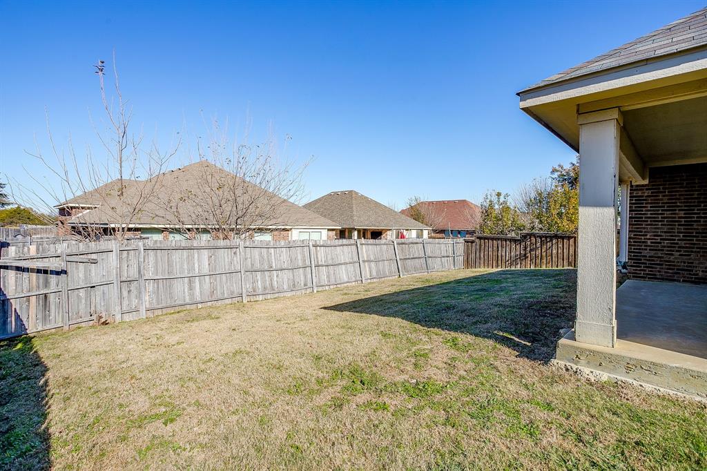 928 Remington Ranch Road Mansfield, TX 76063 - Photo 19 of 20 a view of a backyard