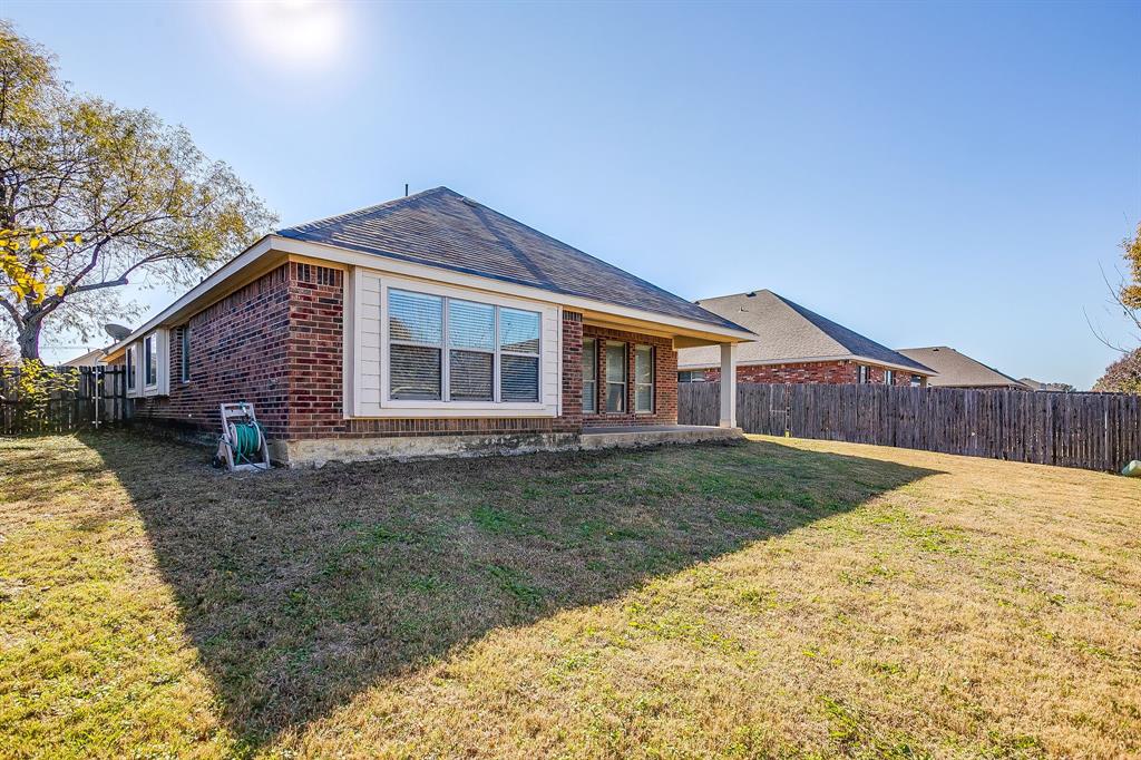 928 Remington Ranch Road Mansfield, TX 76063 - Photo 20 of 20 a front view of a house with garden