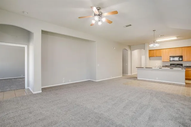 a view of a kitchen with a sink and a window