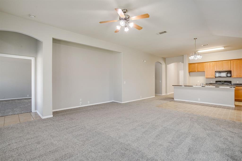 928 Remington Ranch Road Mansfield, TX 76063 - Photo 9 of 20 a view of a kitchen with a sink and a window