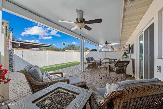 a outdoor living space with furniture and a rug