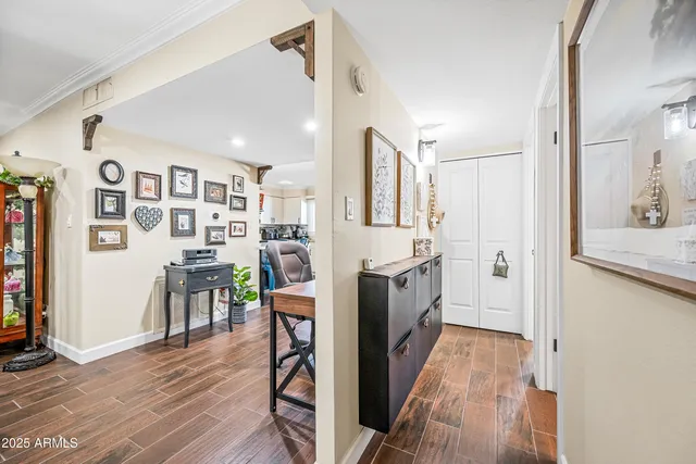 a view of a kitchen with furniture and wooden floor