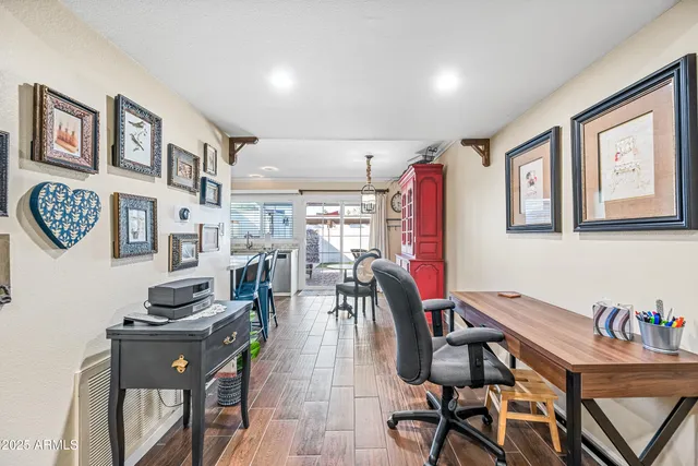 a view of a dining room with furniture and a window