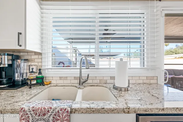 a living room with furniture fireplace and flat screen tv