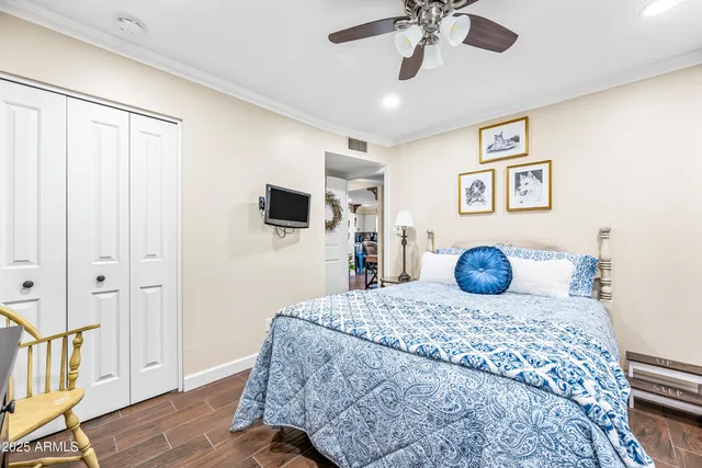 a bedroom with a bed and a chandelier