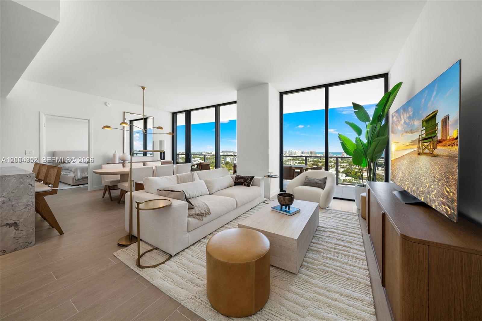 500 Alton Road, Unit 1707 Miami Beach, FL 33139 - Photo 1 of 52 a living room with furniture and a large window