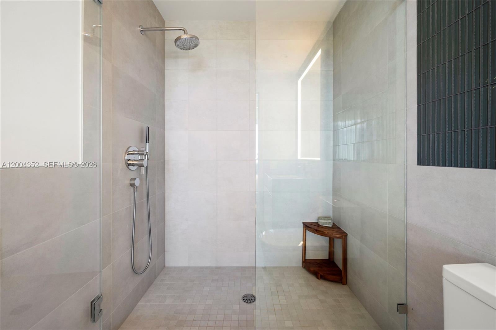 500 Alton Road, Unit 1707 Miami Beach, FL 33139 - Photo 11 of 52 a bathroom with a shower and toilet
