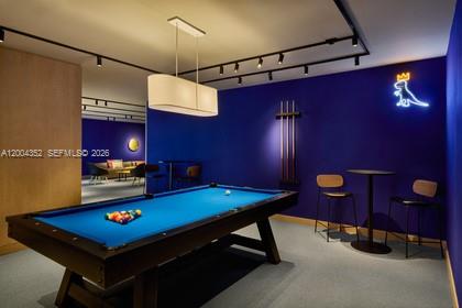 500 Alton Road, Unit 1707 Miami Beach, FL 33139 - Photo 25 of 52 a room with pool table and a chandelier