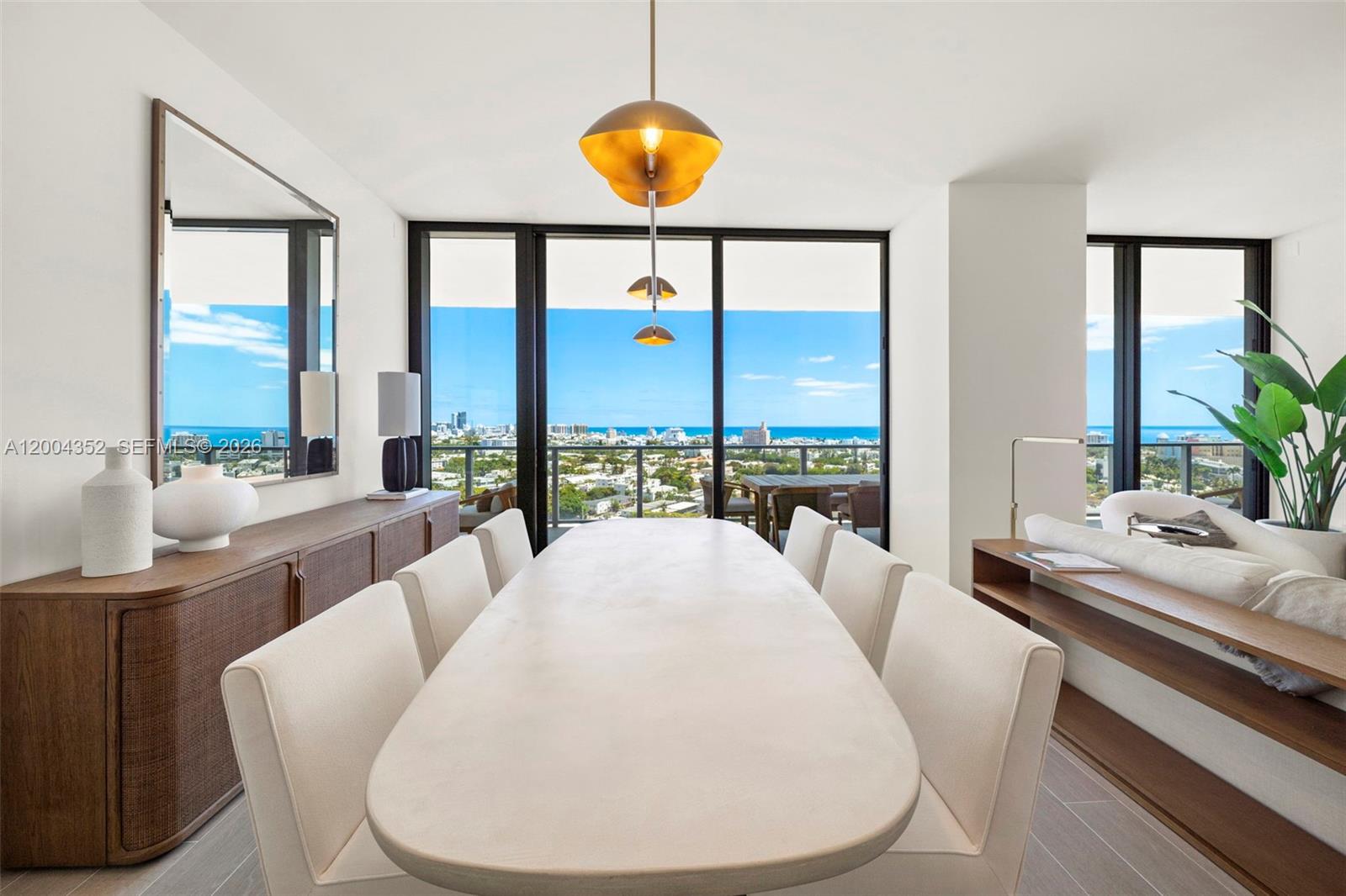 500 Alton Road, Unit 1707 Miami Beach, FL 33139 - Photo 27 of 52 a living room with furniture and a large window