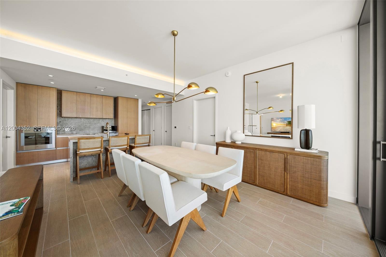 500 Alton Road, Unit 1707 Miami Beach, FL 33139 - Photo 3 of 52 a large kitchen with a table and chairs