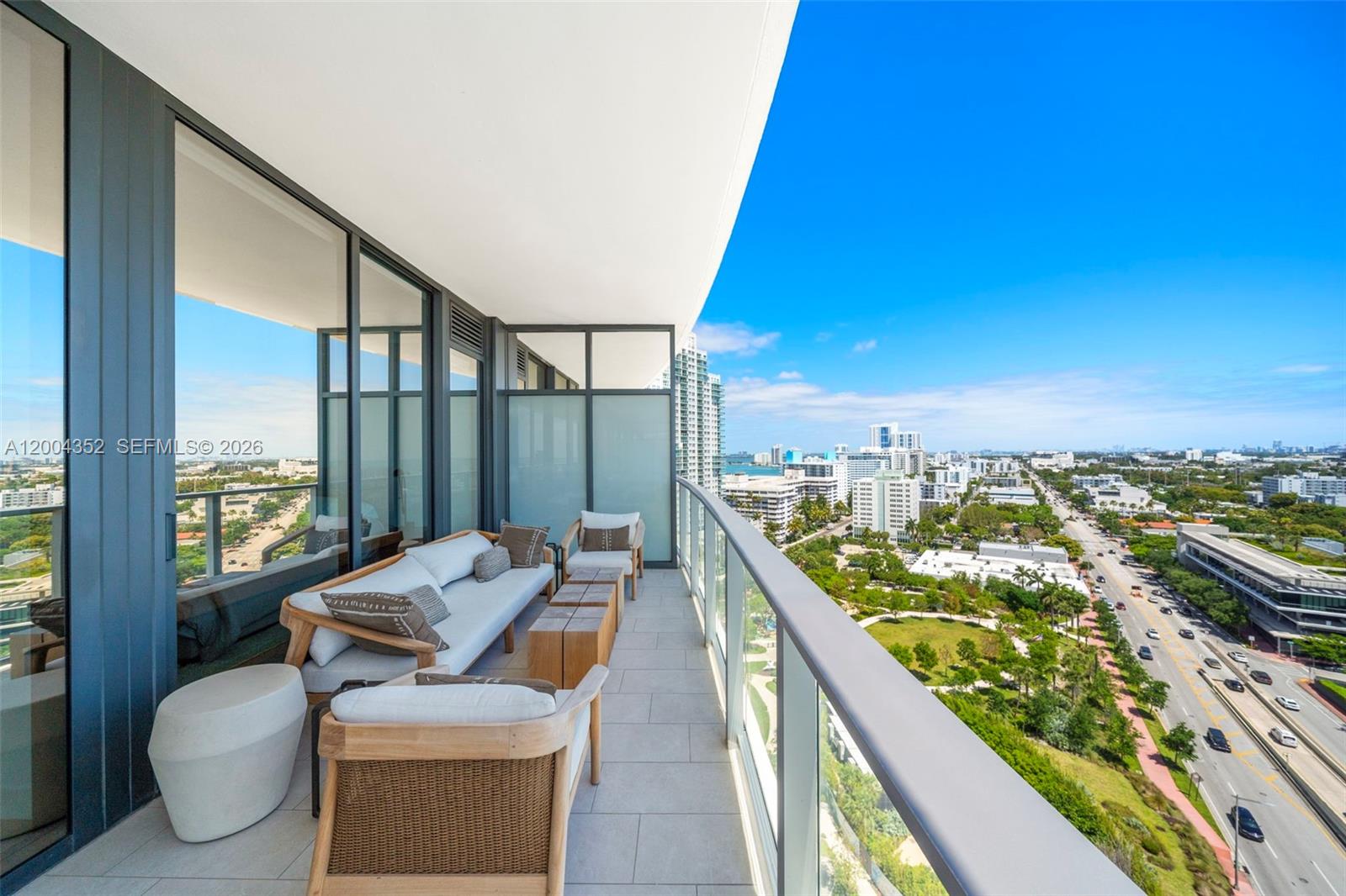 500 Alton Road, Unit 1707 Miami Beach, FL 33139 - Photo 41 of 52 a balcony with furniture and a view of city