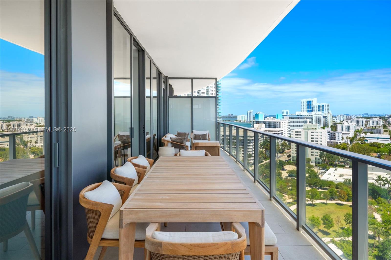 500 Alton Road, Unit 1707 Miami Beach, FL 33139 - Photo 44 of 52 a view of city from a balcony with furniture