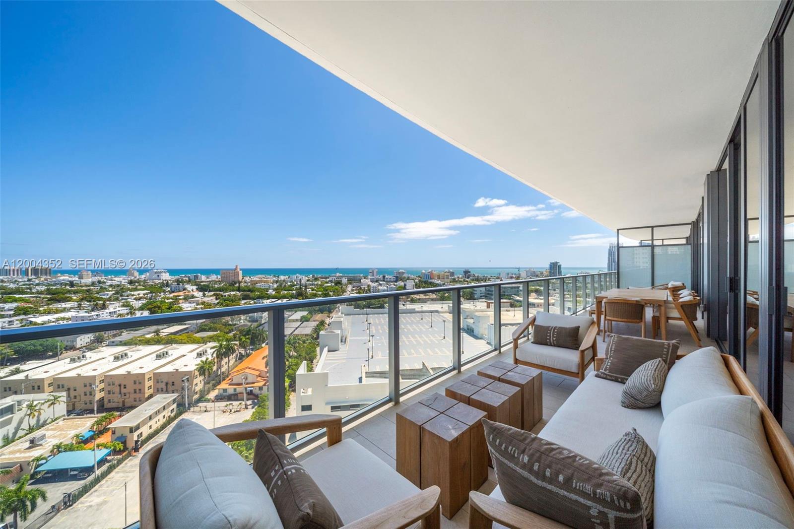 500 Alton Road, Unit 1707 Miami Beach, FL 33139 - Photo 46 of 52 a balcony with furniture and city view