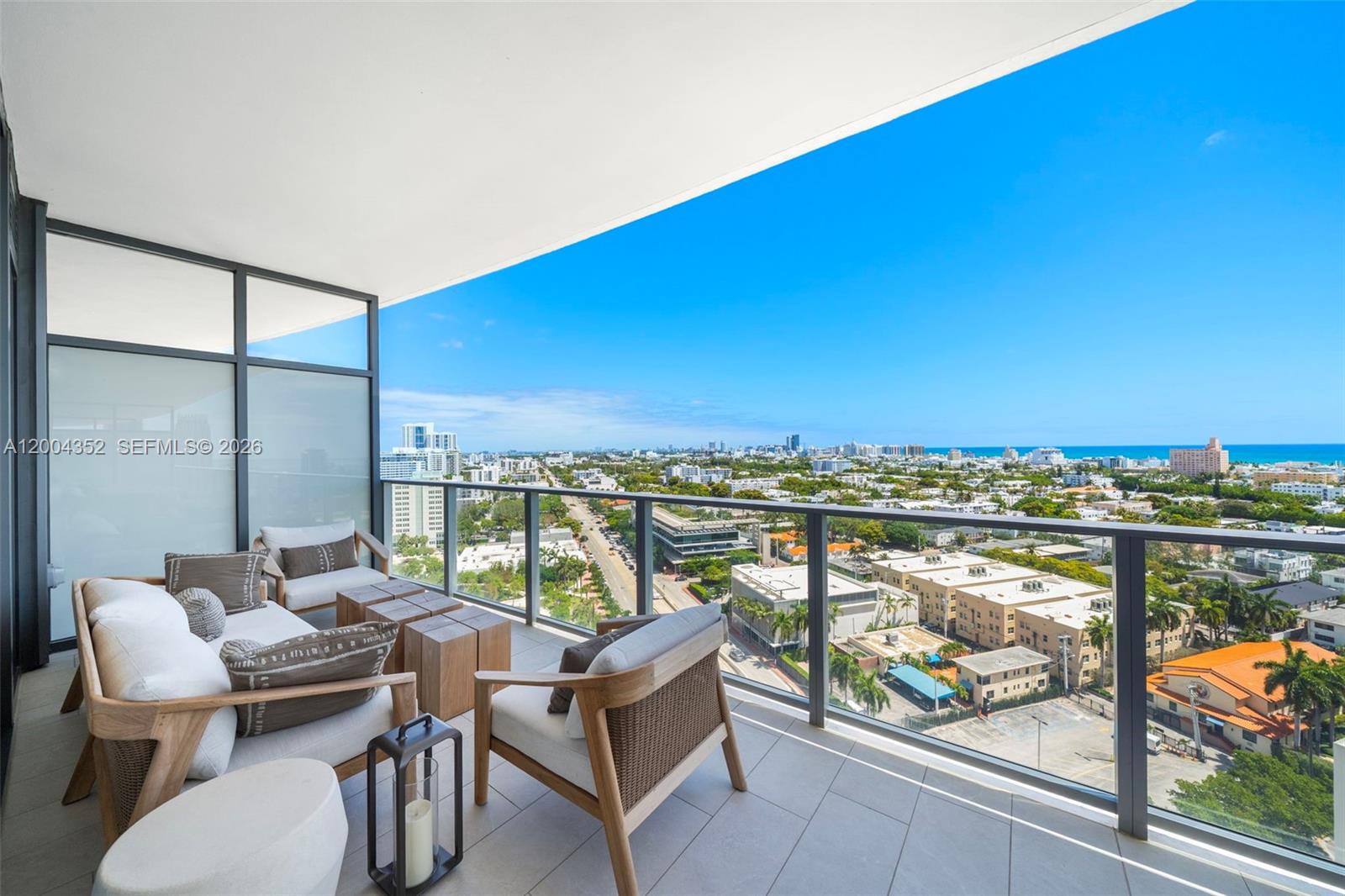 500 Alton Road, Unit 1707 Miami Beach, FL 33139 - Photo 49 of 52 a view of a chairs and table in the balcony