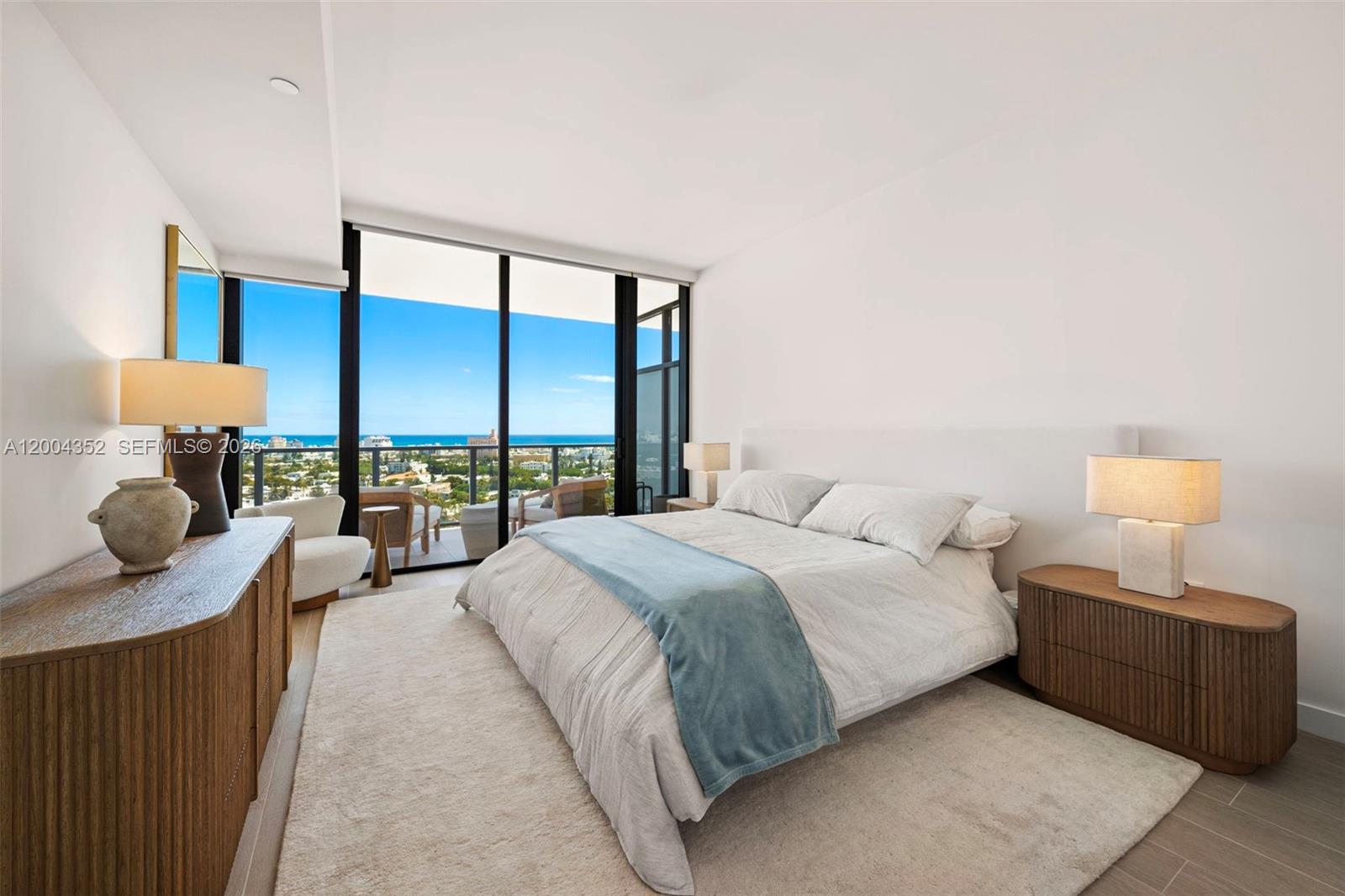 500 Alton Road, Unit 1707 Miami Beach, FL 33139 - Photo 7 of 52 a bedroom with a bed and a large window