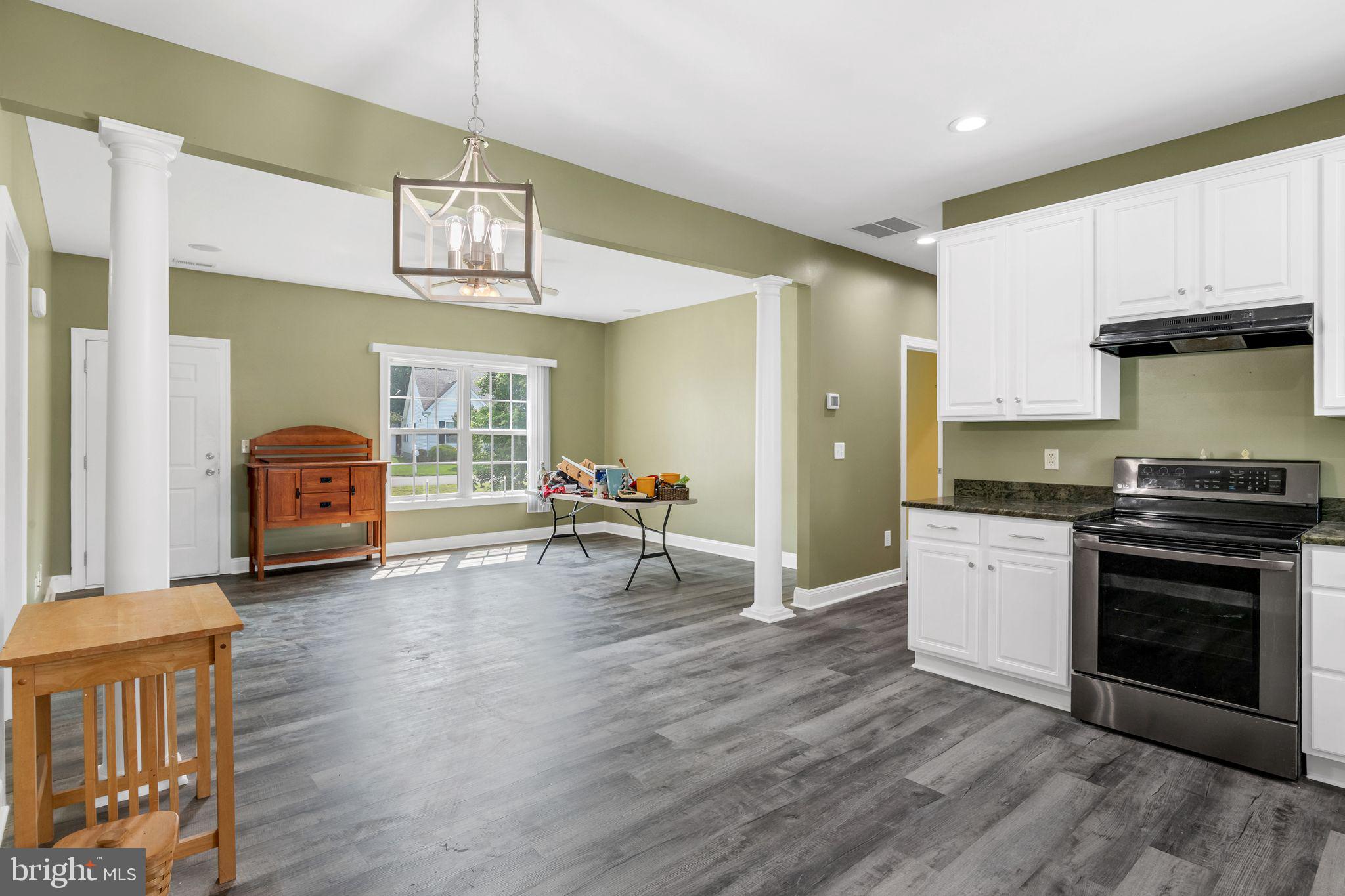 27407 Walking Run Milton, DE 19968 - Photo 13 of 25 a living room with furniture and a fireplace