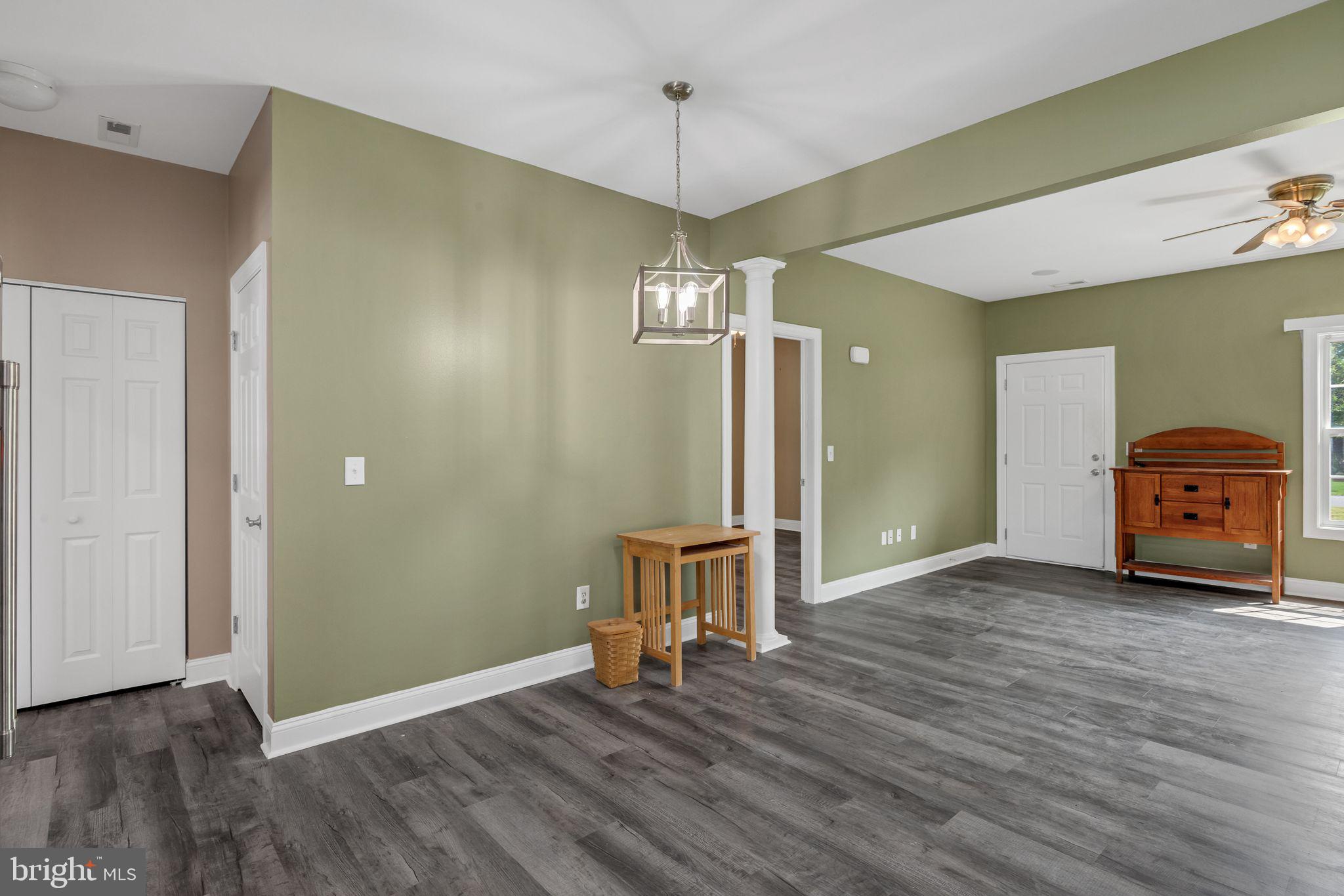 27407 Walking Run Milton, DE 19968 - Photo 14 of 25 a view of a room with wooden floor and staircase