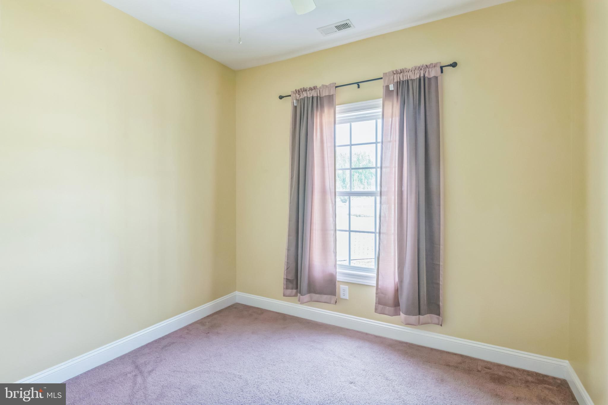 27407 Walking Run Milton, DE 19968 - Photo 18 of 25 an empty room with windows