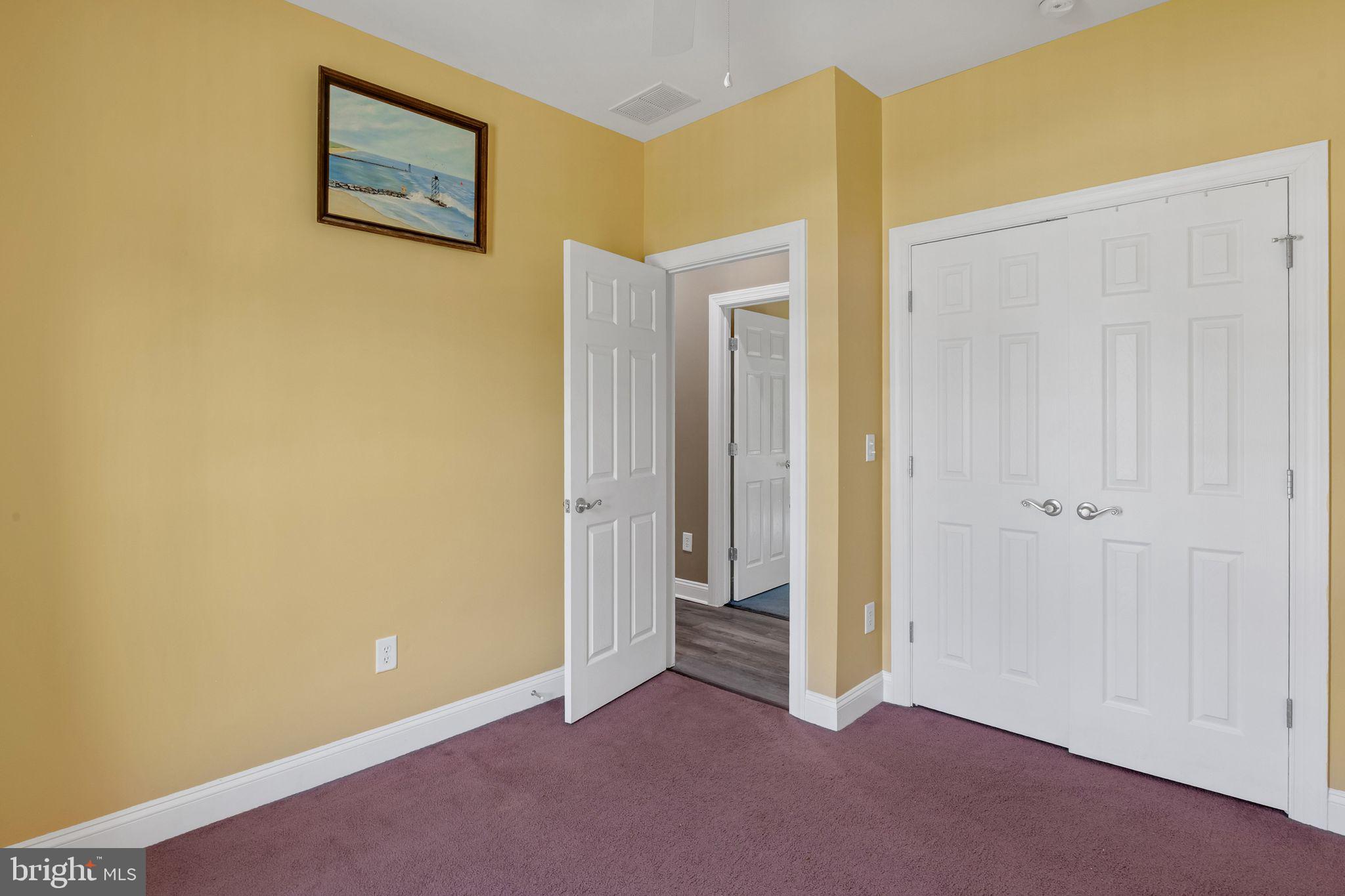 27407 Walking Run Milton, DE 19968 - Photo 19 of 25 an empty room with windows