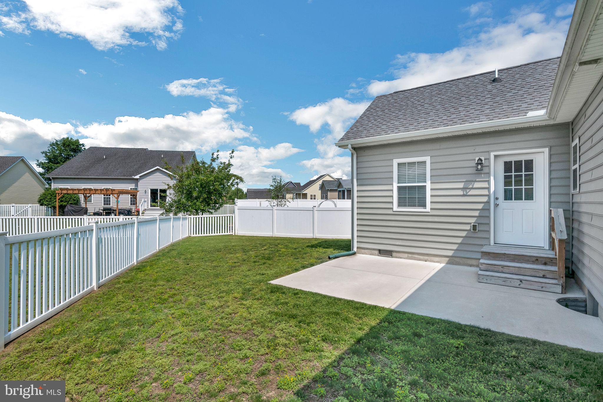 27407 Walking Run Milton, DE 19968 - Photo 24 of 25 a view of backyard with deck
