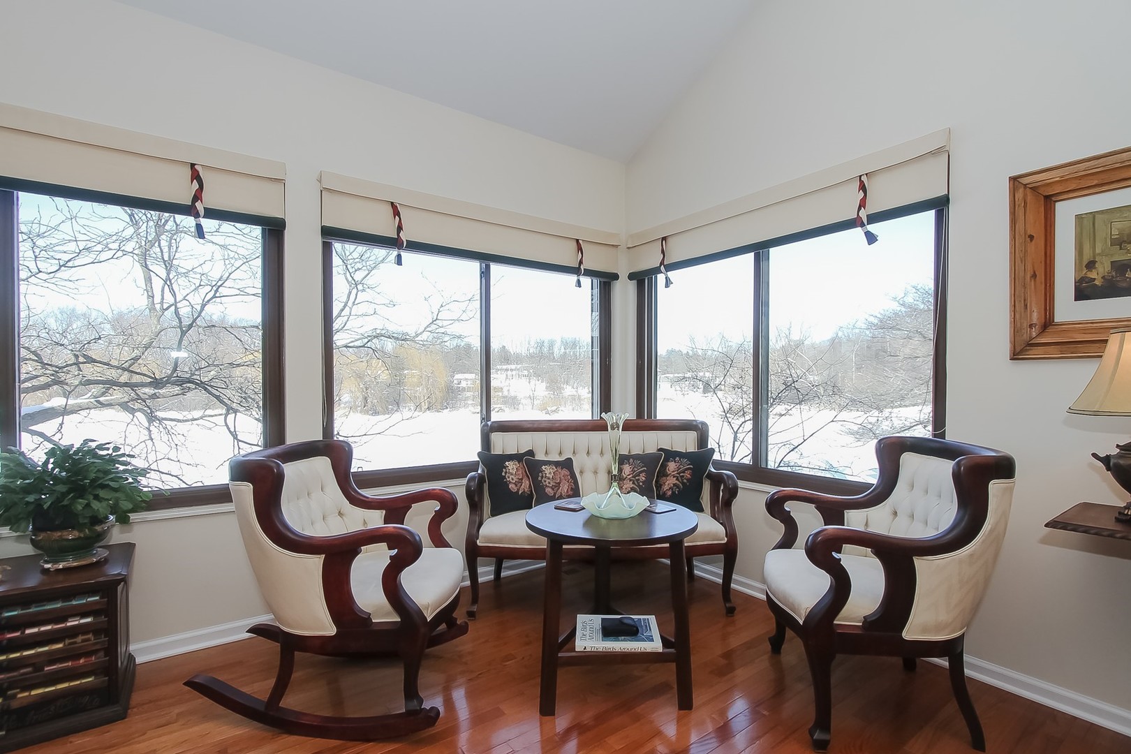 842 Oak Hill Road Lake Barrington, IL 60010 - Photo 12 of 36 a dining room with furniture large windows and a chandelier