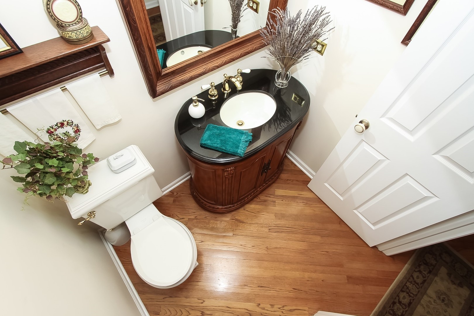 842 Oak Hill Road Lake Barrington, IL 60010 - Photo 13 of 36 a bathroom with a toilet mirror and sink