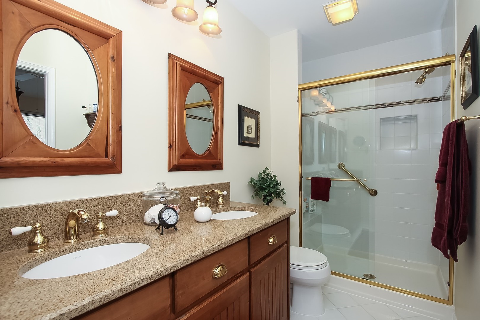 842 Oak Hill Road Lake Barrington, IL 60010 - Photo 17 of 36 a bathroom with a granite countertop sink toilet and shower
