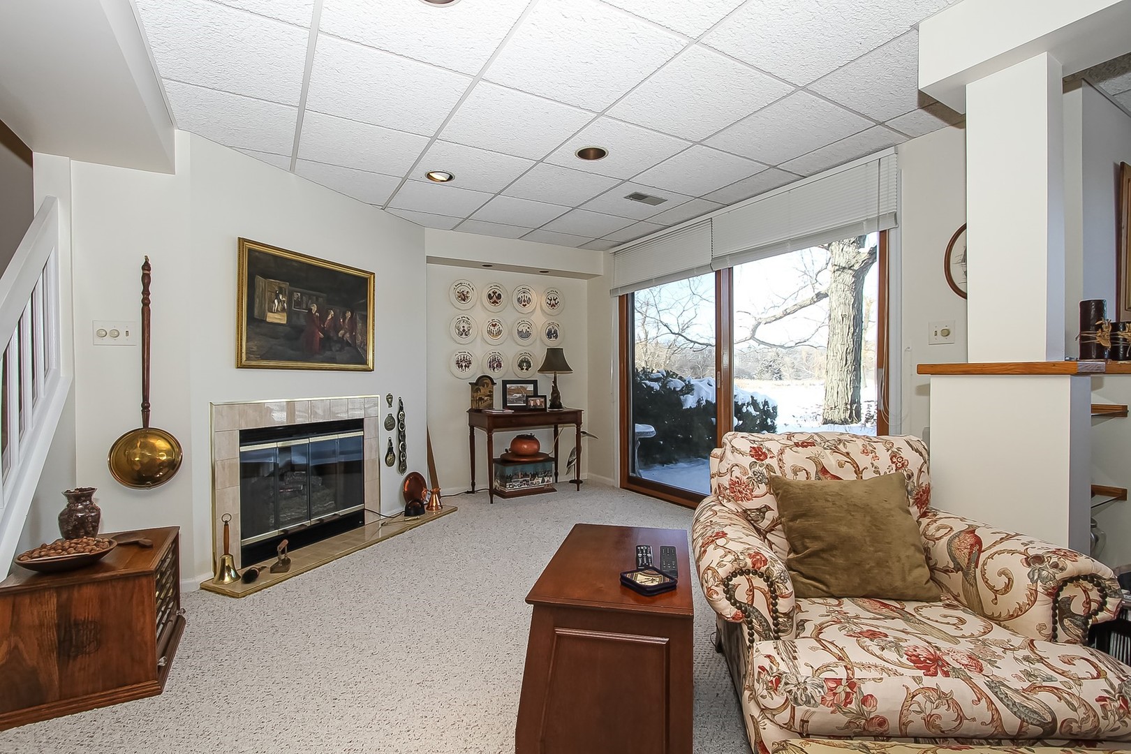 842 Oak Hill Road Lake Barrington, IL 60010 - Photo 21 of 36 a living room with furniture a flat screen tv and a fireplace