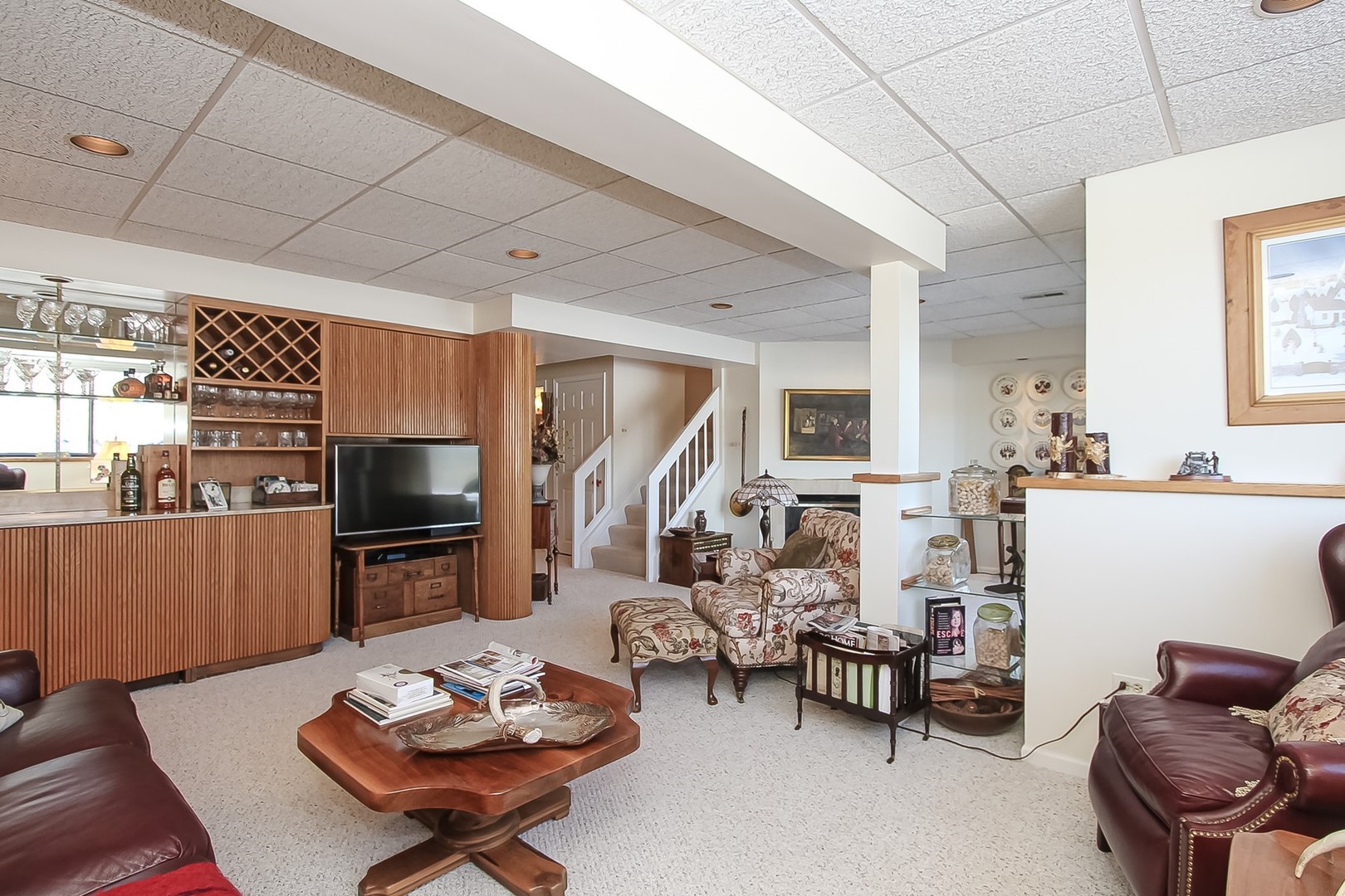 842 Oak Hill Road Lake Barrington, IL 60010 - Photo 24 of 36 a living room with furniture a flat screen tv and kitchen view