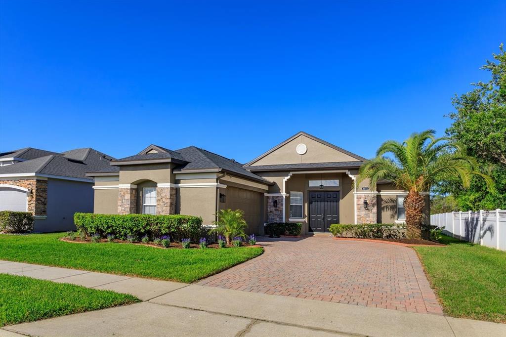 1572 St Regis Point Sanford, FL 32771 - Photo 1 of 30 a front view of a house with a yard and garage