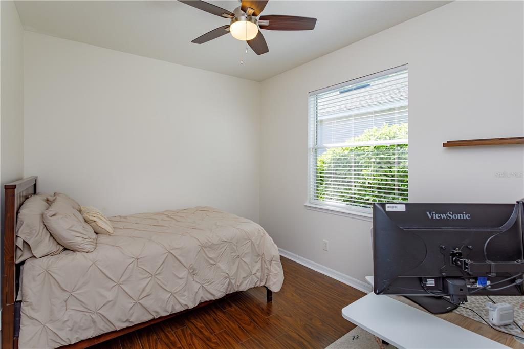 1572 St Regis Point Sanford, FL 32771 - Photo 17 of 30 a bedroom with a bed and a window