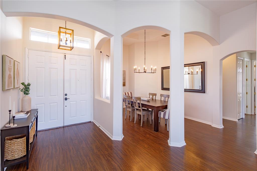 1572 St Regis Point Sanford, FL 32771 - Photo 2 of 30 a view of a hallway with wooden floor and furniture