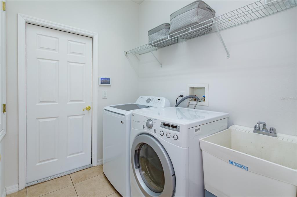 1572 St Regis Point Sanford, FL 32771 - Photo 21 of 30 a utility room with dryer and washer