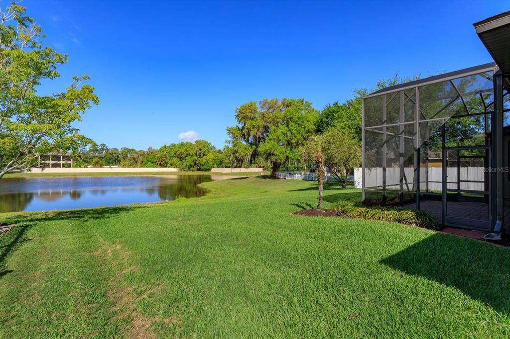 1572 St Regis Point Sanford, FL 32771 - Photo 26 of 30 a view of yard with swimming pool and green space