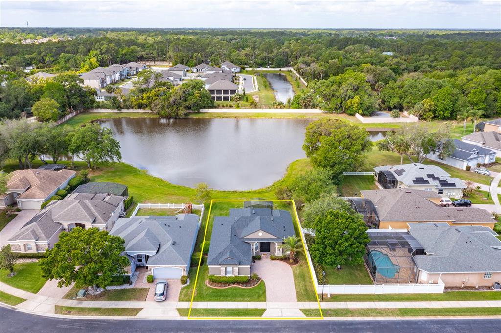1572 St Regis Point Sanford, FL 32771 - Photo 28 of 30 an aerial view of residential houses with outdoor space and lake view