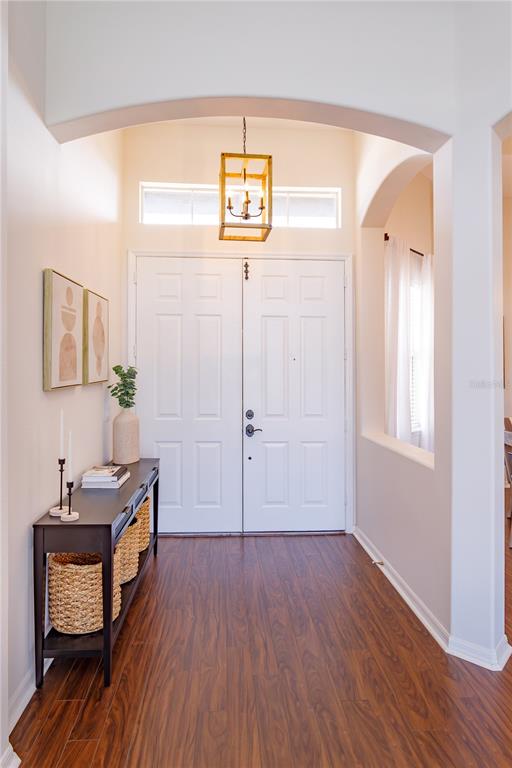 1572 St Regis Point Sanford, FL 32771 - Photo 3 of 30 a view of a hallway to a room with wooden floor and windows