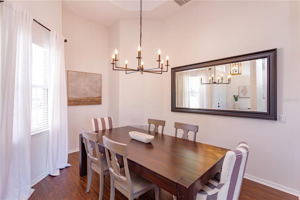 1572 St Regis Point Sanford, FL 32771 - Photo 4 of 30 a view of a dining room with furniture window and wooden floor