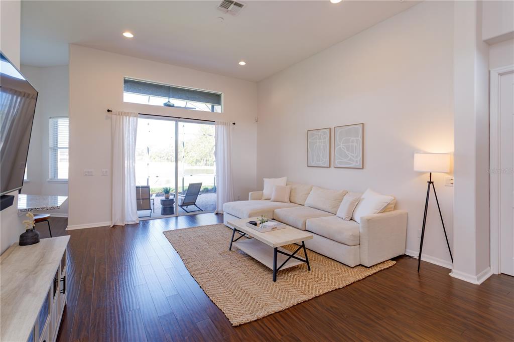 1572 St Regis Point Sanford, FL 32771 - Photo 7 of 30 a living room with furniture and a large window