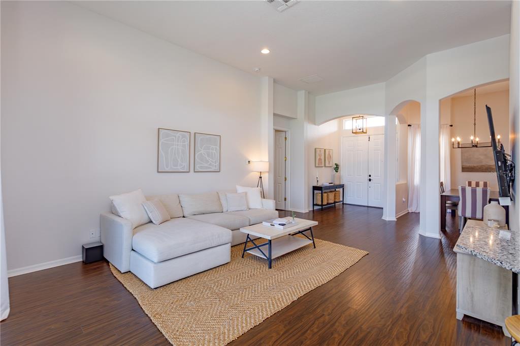 1572 St Regis Point Sanford, FL 32771 - Photo 8 of 30 a living room with furniture and a wooden floor