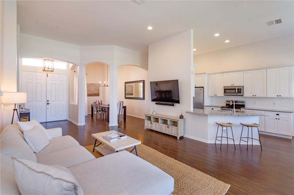 1572 St Regis Point Sanford, FL 32771 - Photo 9 of 30 a living room with furniture and a flat screen tv